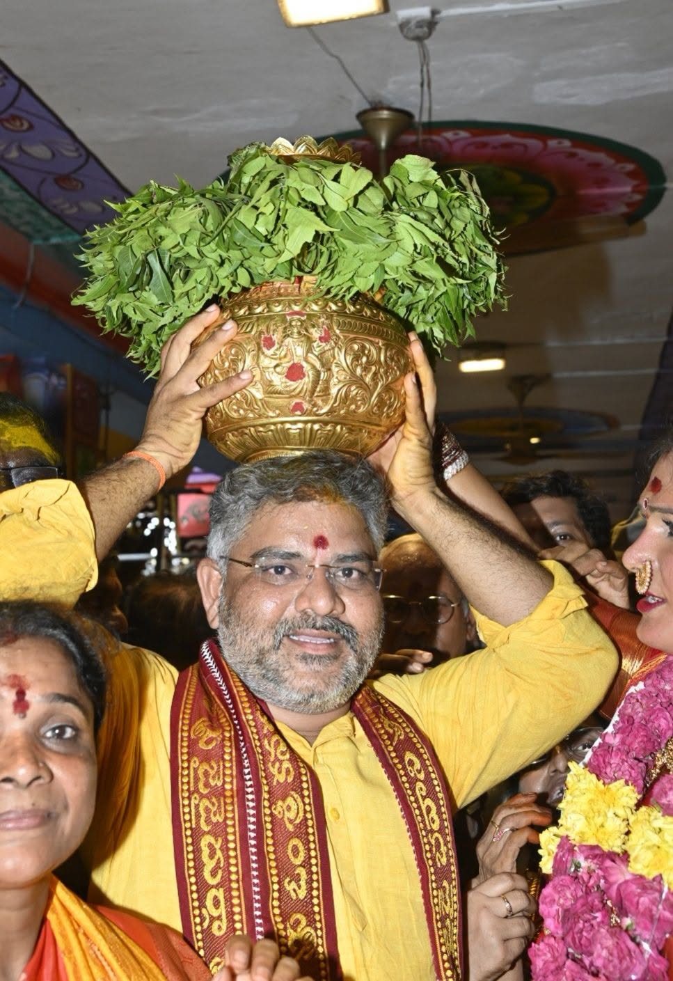 Talikota Hari Krishna carrying the bonam during the Sri Bhagyanagar Mahankali Bonalu Jatara procession